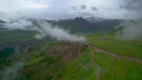 Low clouds in the mountains. Aerial view of low fog in mountainous area Video stock 250996272