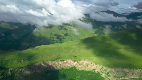 Low clouds in the mountains. Aerial view of low fog in mountainous area Video stock 250996619
