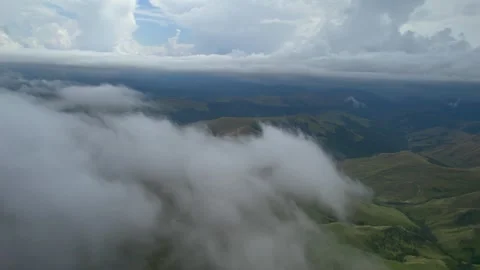 Low clouds in the mountains. Aerial view of low fog in mountainous area Stock Footage 284119113