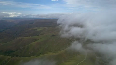 Low clouds in the mountains. Aerial view of low fog in mountainous area Stock Footage 284119247