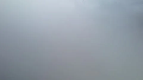 Low clouds in the mountains. Aerial view of low fog in mountainous area Stock Footage 284119398