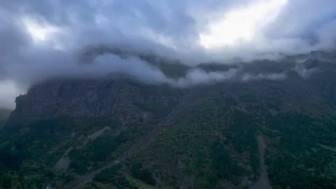 Low clouds in the mountains. Aerial view of low fog in mountainous area Stock Footage 291996712