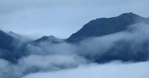 Low clouds in the mountains. Vew of low fog in mountainous area Stock Footage 245434198