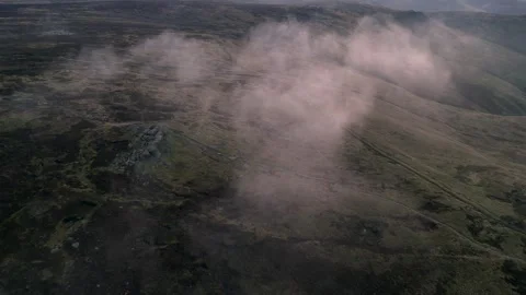 Low clouds moving over the Peak District hills in England Stock Footage 318256353