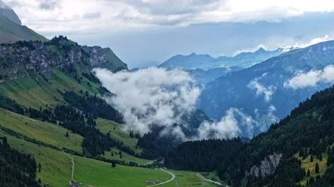 Low Clouds Over Alpine Valley Landscape in Switzerland Stock Photos