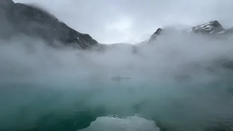 Low Clouds Over Joffre Upper Lake with Turquoise Water and Rugged Alpine Peaks Stock-Footage 346985232