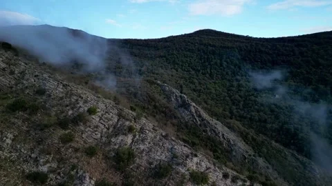 Low clouds over the mountains from a drone Stock Footage 257090710