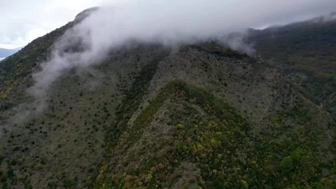 Low clouds over the mountains from a drone Stock Footage 257090775