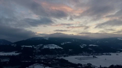 Low clouds over snowy hills Stock Footage 329490722