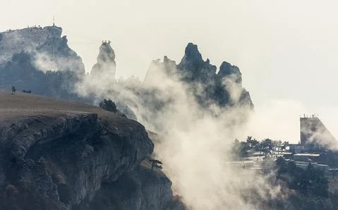 Low clouds over valley, view from the mountains. Low clouds. Stock Photos