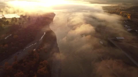 Low clouds over Yellowstone river at sunrise from above Stock Footage 312041307