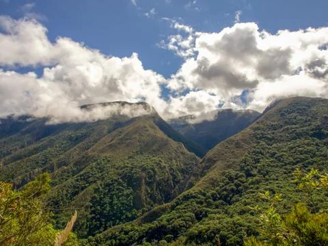 Low clouds partially cover the top of the Paramo Chontales mountains in the s Stock-Fotos