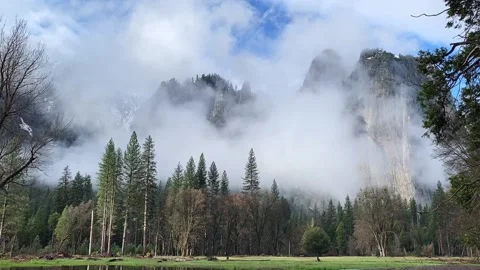 Low Clouds Rolling in Front of Mountains in Yosemite Valley Stock Footage 133971055