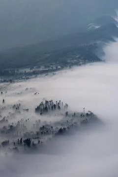 Low Clouds rolling in over mountain ridge Stock Photos