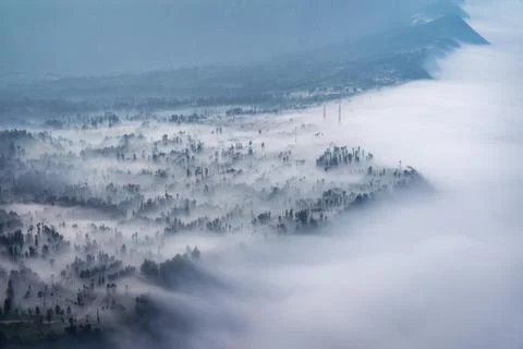 Low Clouds rolling in over mountain ridge Stock Photos