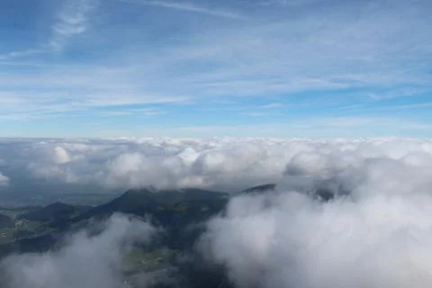 Low clouds surrounding mountain Stock Photos