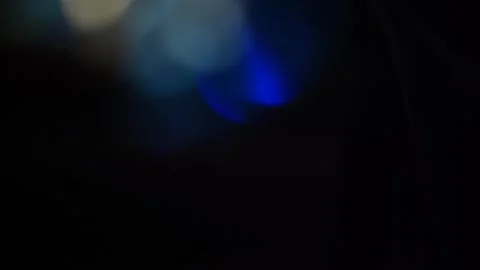 Low colored bokeh light in the dark Stock Footage 315541792