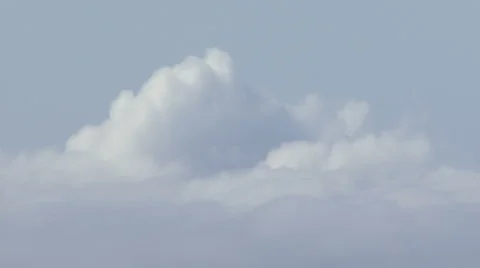 Low-contrast clouds in a pale blue sky Stock Footage 988592