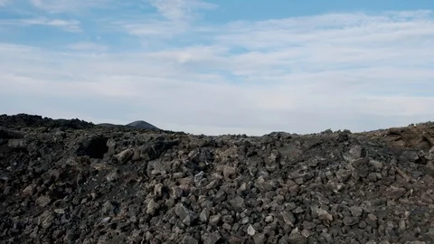 Low Crawl through Volcanic Landscape Stock Footage 101741114