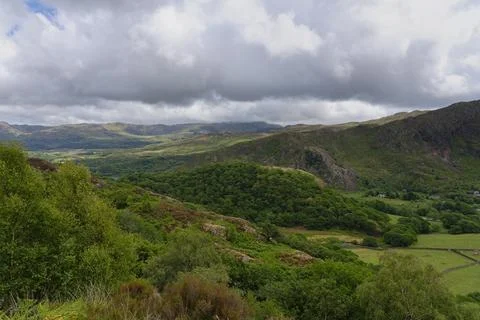 Low, dark rain clouds linger over the Welsh countryside near Beddgelert. Stock Photos