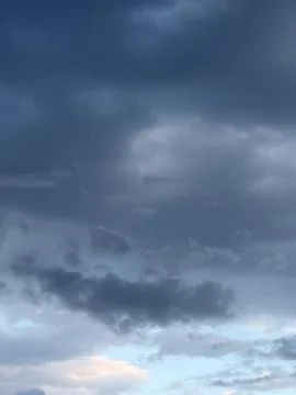 Low Dark Rain Clouds With Pale Horizon 写真素材