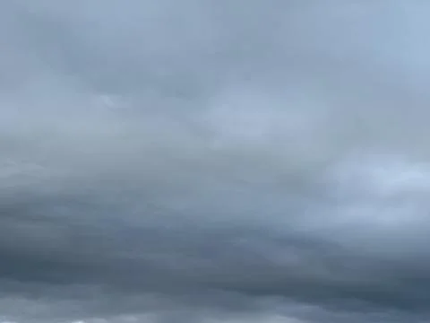 Low Dark Storm Clouds Across Gray Sky 写真素材