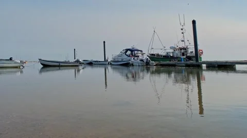 Low down view across Wells Harbour, Norfolk Coast. Static camera shot. Stock-Footage 310466432