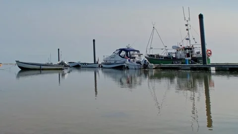 Low down view across Wells Harbour, Norfolk Coast. Push in shot. Stock-Footage 310466739