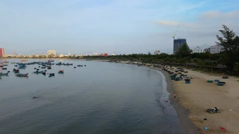 Low Drone Flight Along Quiet Sandy Beach in Da Nang Vietnam Stockbeeldmateriaal 340487337
