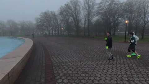 A low drone flight in Flushing Meadows Corona Park on a foggy morning Stock Footage 333267444