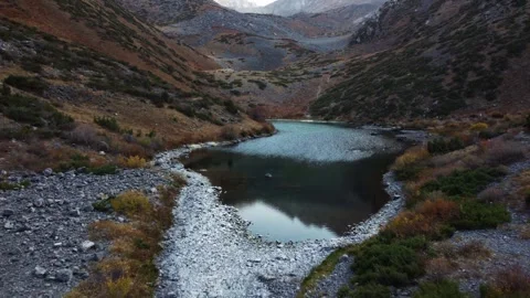 Low Drone Flight Over Alpine Lake Surface. Kazakhstan, Sayram-Ugam Park Stock Footage 332937073