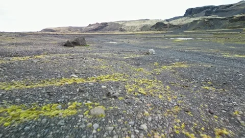 Low drone flight over black volcanic gravel plain Iceland 4K Stock-Footage 343869663