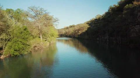 Low drone flight over a calm river between cypress trees in Texas Stock-Footage 154873460