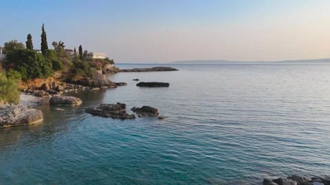 Low Drone Flight Over Calm Sea Toward Greek Breakwater Stock-Footage 334655351