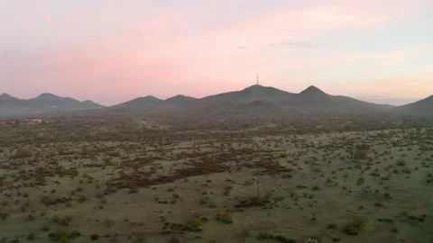 Low drone flight over the Sonoran Desert of Arizona approaching a road Stock Footage 131347936