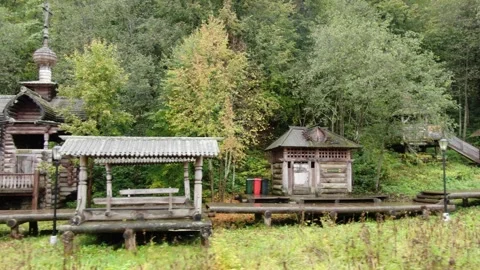 Low drone flight right to left near wooden shrine Stock Footage 324756168