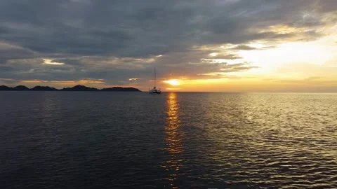 Low Drone Flight Toward Sailboat at Sunset, Koh Muk Thailand Stock Footage 331224692