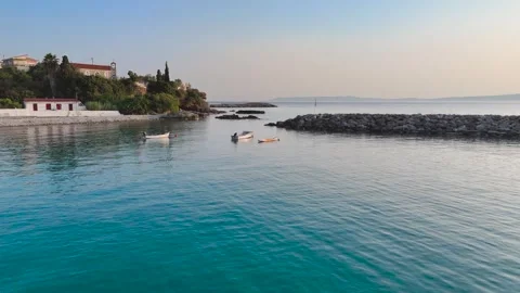 Low Drone Flight Toward Small Boats in Calm Greek Bay Stock-Footage 334632015