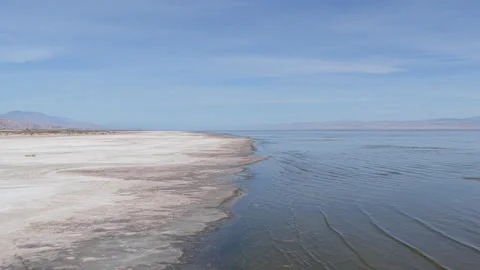 Low Drone Flyover Along Retreating Shoreline of the Salton Sea Video stock 332683136
