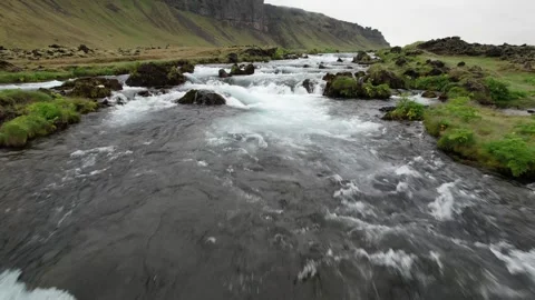 Low drone flyover of cascading waterfall on the Fossalar river, Iceland Stock Footage 346551895