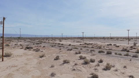 Low Drone Flyover of Empty Streets and Power Lines in Salton City Vídeo Stock 332682818