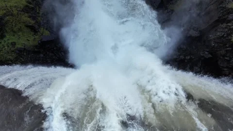 Low drone flyover of Gufufoss waterfall crest and plunge, East Iceland Stock Footage 346552026