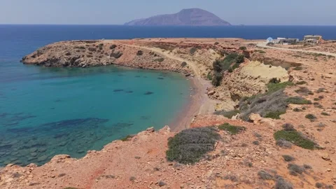 Low Drone Flyover from Karpathos Revealing Kassos &amp; Agios Thodoros Beach Stock Footage 325068071