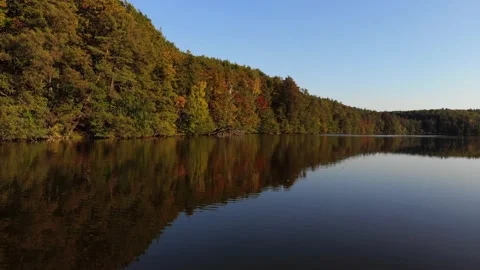 Low drone flyover over autumn lake in Brandenburg, Germany Stock Footage 143399024
