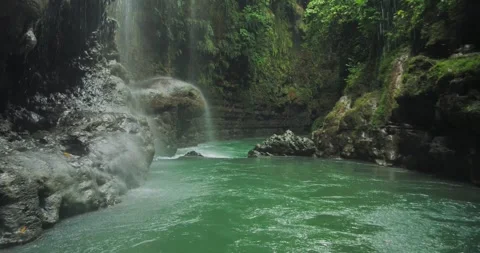 Low Drone Following River Flow with Immersive Jungle Canyon Perspective Stock Footage 332654000
