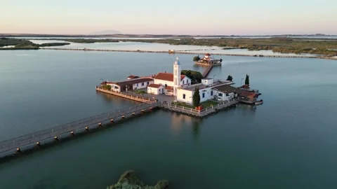 Low Drone Orbit Around Agios Nikolaos Monastery Revealing Bridge and Lagoon Vídeos de archivo 340556734
