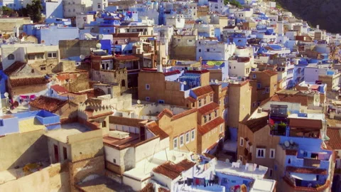 Low Drone Pull Back Over Chefchaouen Rooftops Stock Footage 336571128
