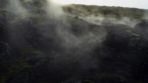 Low Drone Reveals Hidden Sun Through Geothermal Steam Over Volcanic Ridge 스톡 동영상 339071074