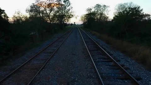 Low Drone Shot Following Parallel Railroad Tracks in Small Texas Town Early 스톡 동영상 308189181