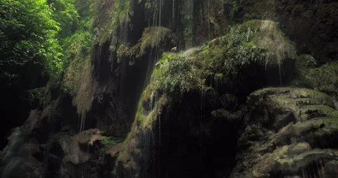 Low Drone Shot Following River Flow Through Tropical Canyon Forest Stock-Footage 332653032